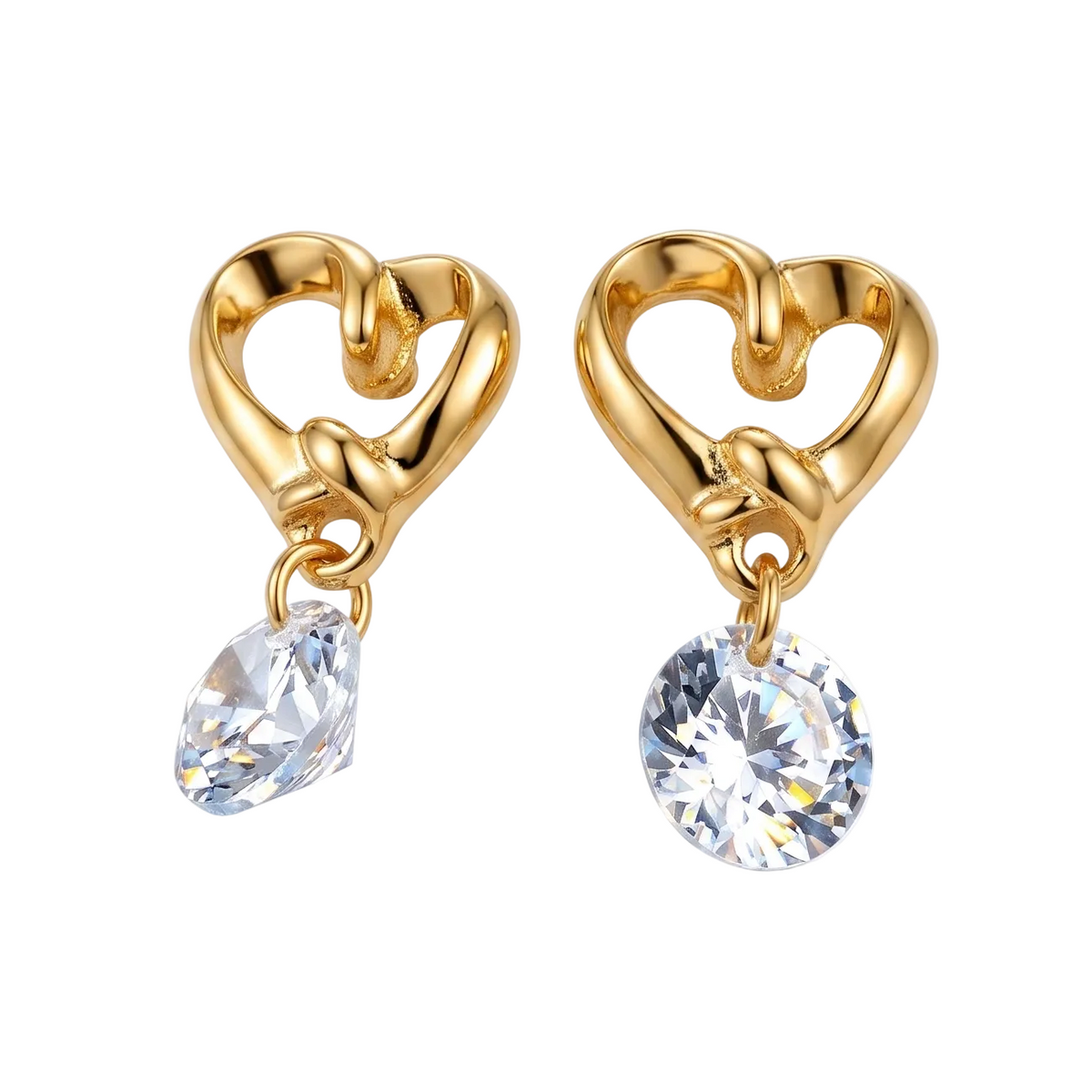 A pair of gold heart-shaped dangle earrings with clear faceted gemstones, shown on a clean light gray background.