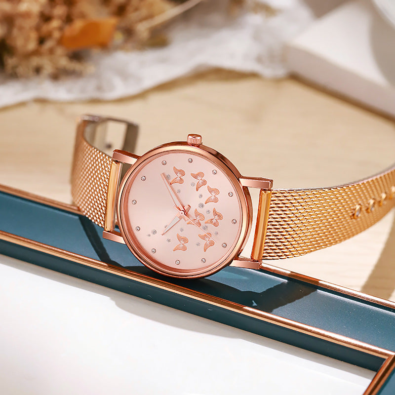 Montre à quartz décontractée pour femme avec boucle de couleur unie et papillon