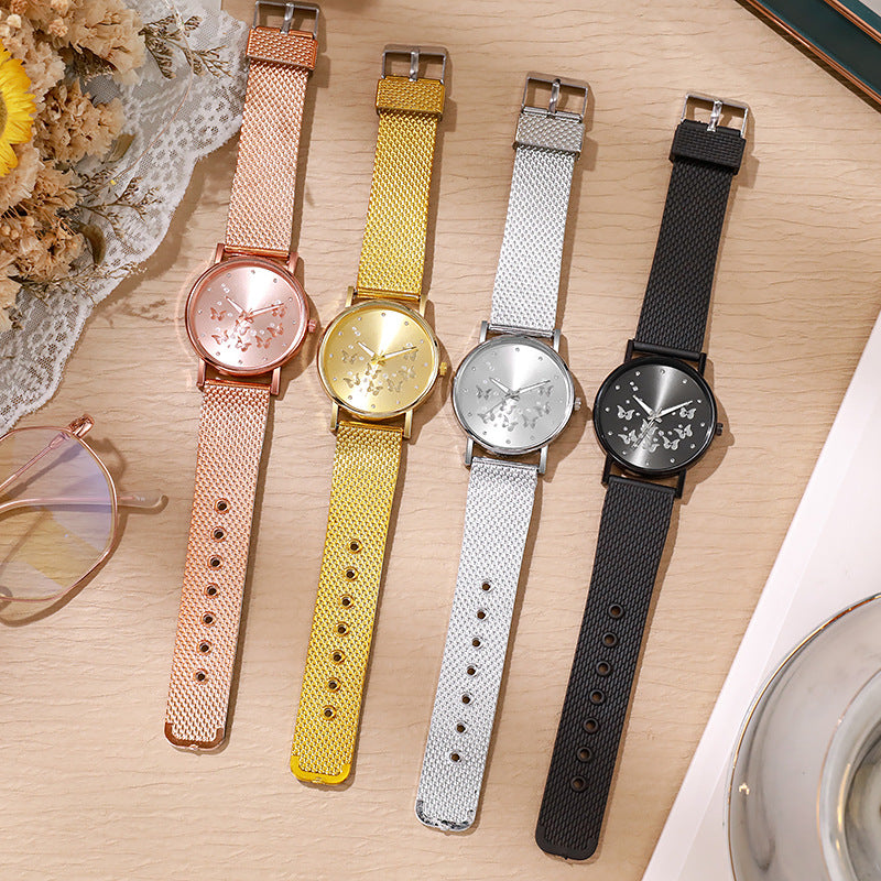 Montre à quartz décontractée pour femme avec boucle de couleur unie et papillon