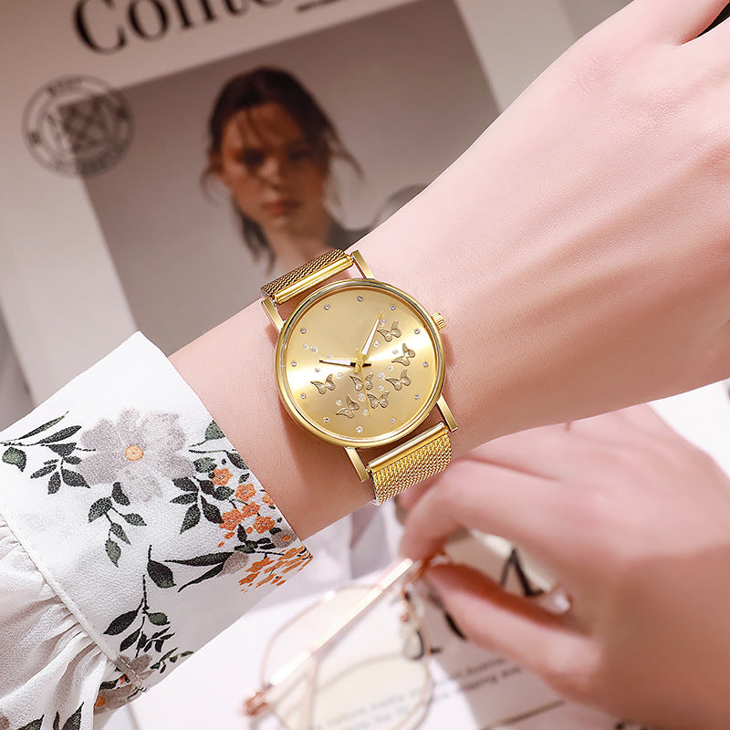 Montre à quartz décontractée pour femme avec boucle de couleur unie et papillon
