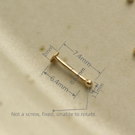 Petit anneau de nez en or jaune 14 carats