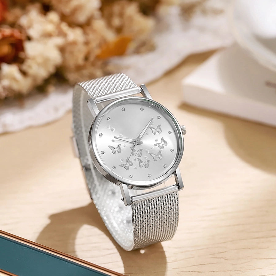 Montre à quartz décontractée pour femme avec boucle de couleur unie et papillon