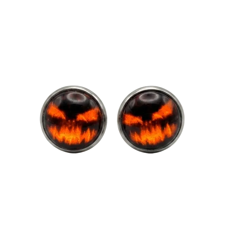 Round earrings with fiery design on a light gray background
