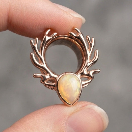 single rose gold stainless steel ear tunnel featuring a deer antler design and opal inlay, shown in 10mm size