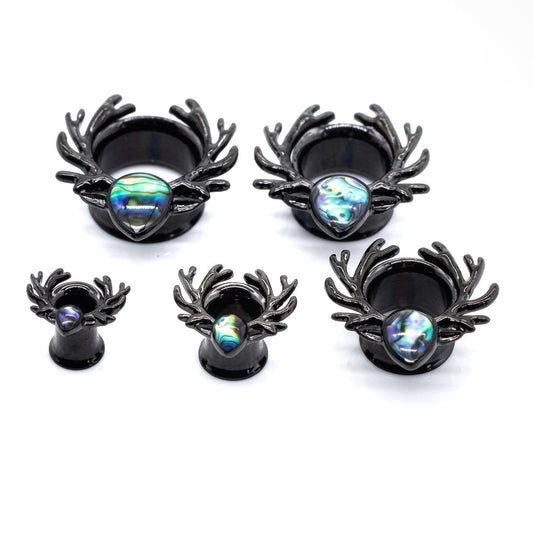 Set of five different size black deer antler-shaped Ear Tunnels with opal stones on a white background